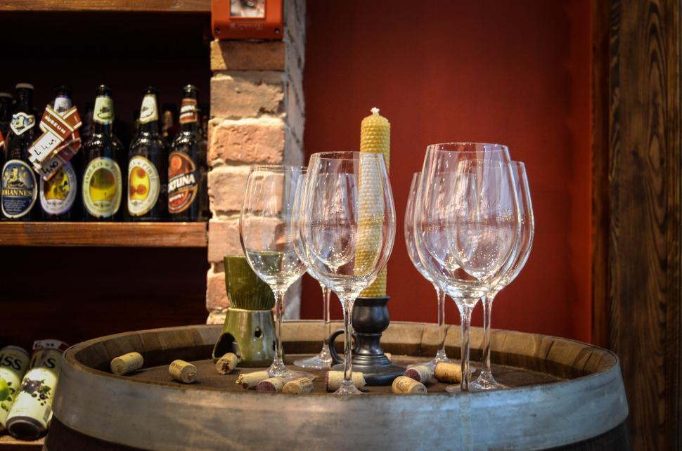 Free Image of Barrel With Wine Glasses and Bottles 