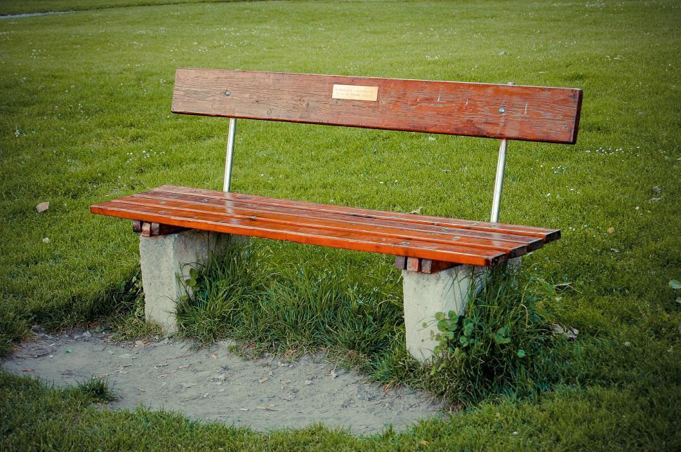 Free Image of Wooden Bench on Lush Green Field 