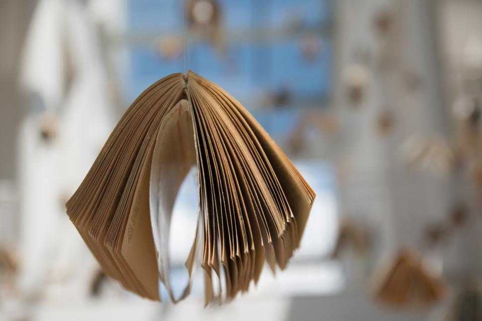Free Image of Close Up of an Open Book on a Table 