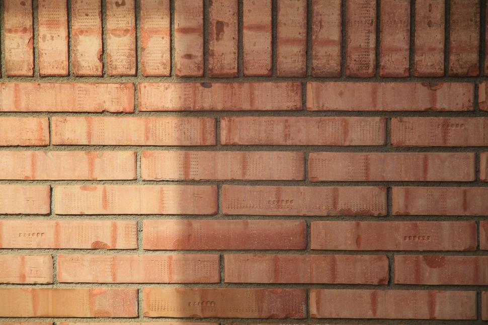 Free Image of Light Shining on Brick Wall 