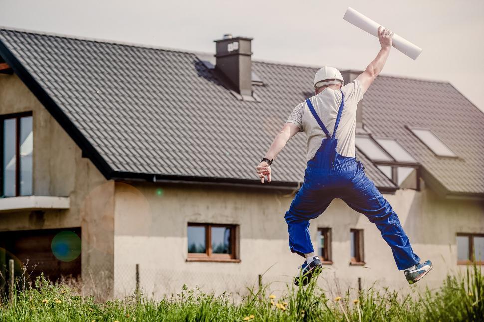Free Image of Man Jumping in the Air With a Baseball Bat 
