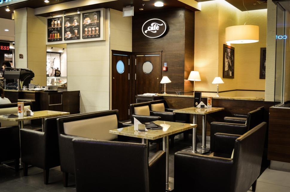 Free Image of Modern Restaurant With Tables, Chairs, and a Bar 