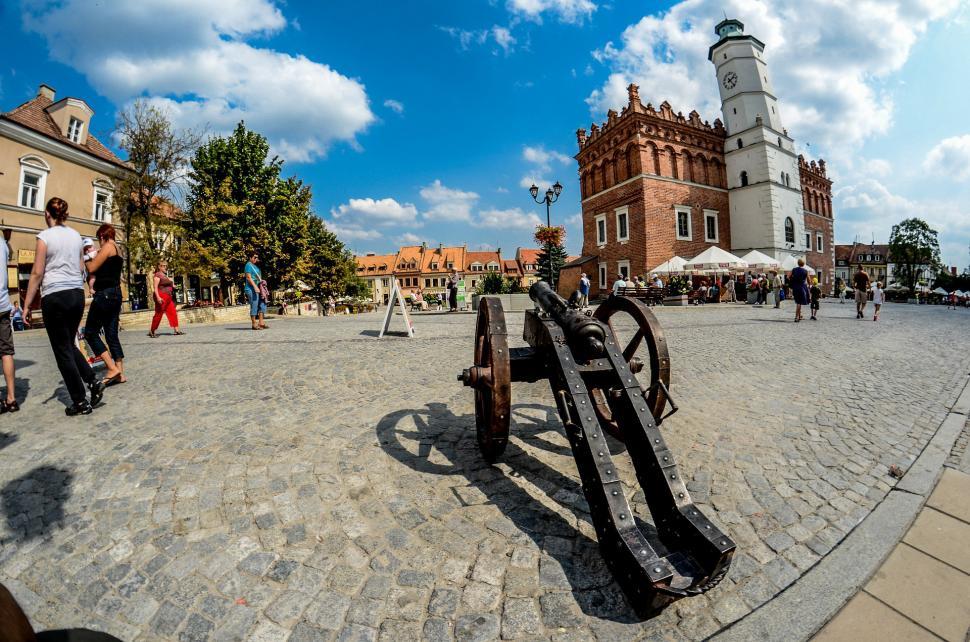 Free Image of Group of People Walking Around a Town Square 