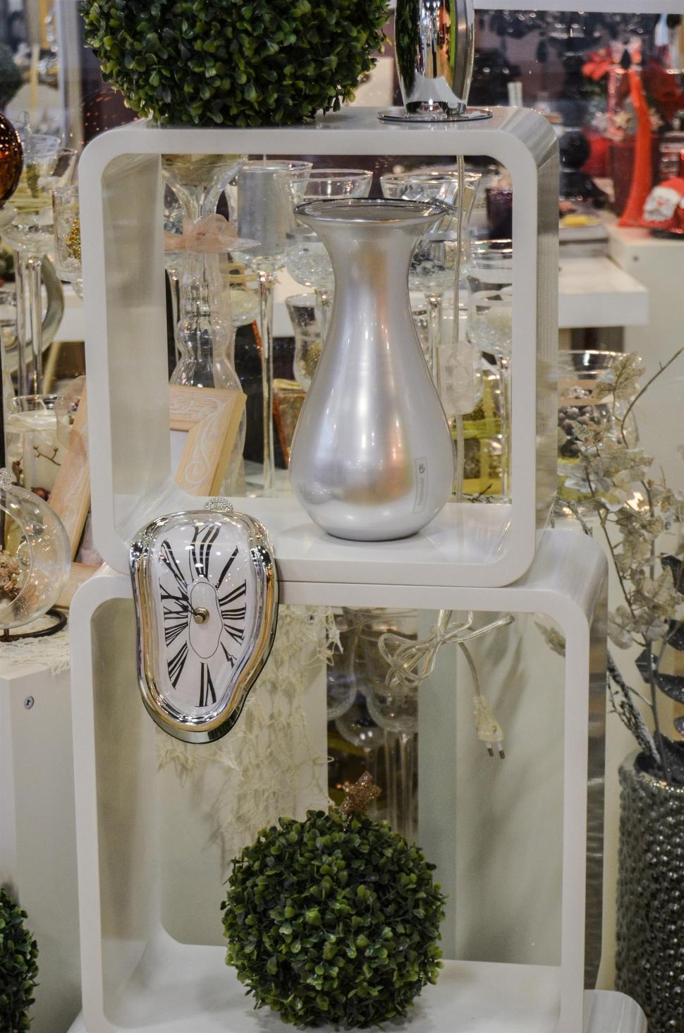Free Image of White Shelf With Clock and Plants 