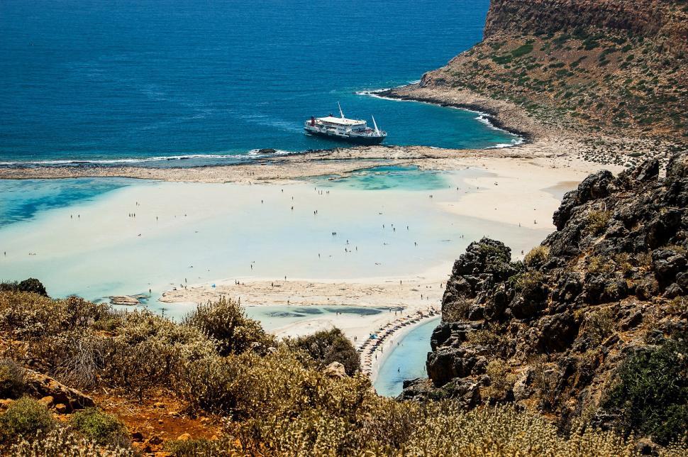 Free Image of Boat Sailing Near Beach 