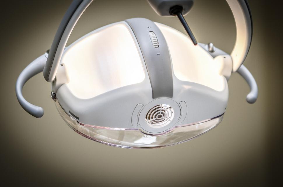 Free Image of Pair of Headphones Hanging From the Ceiling 