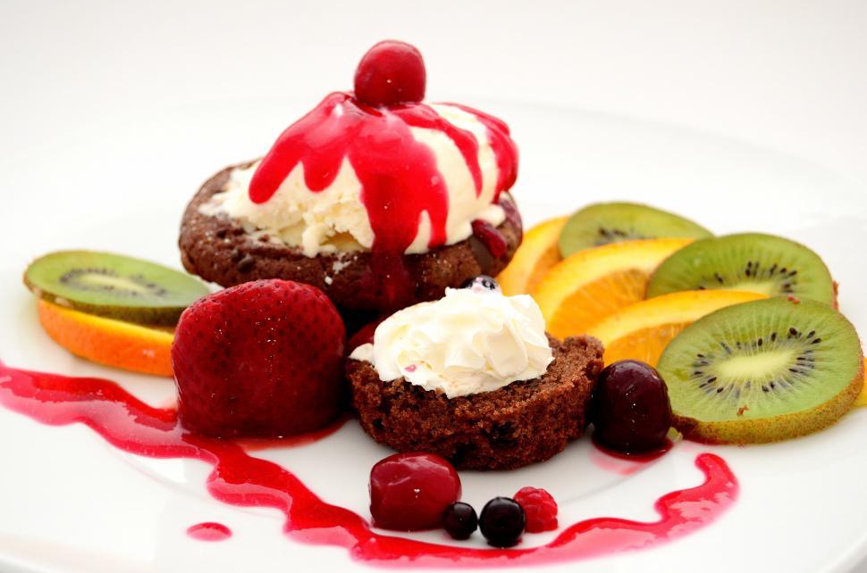Free Image of White Plate Topped With Fruit and Ice Cream 