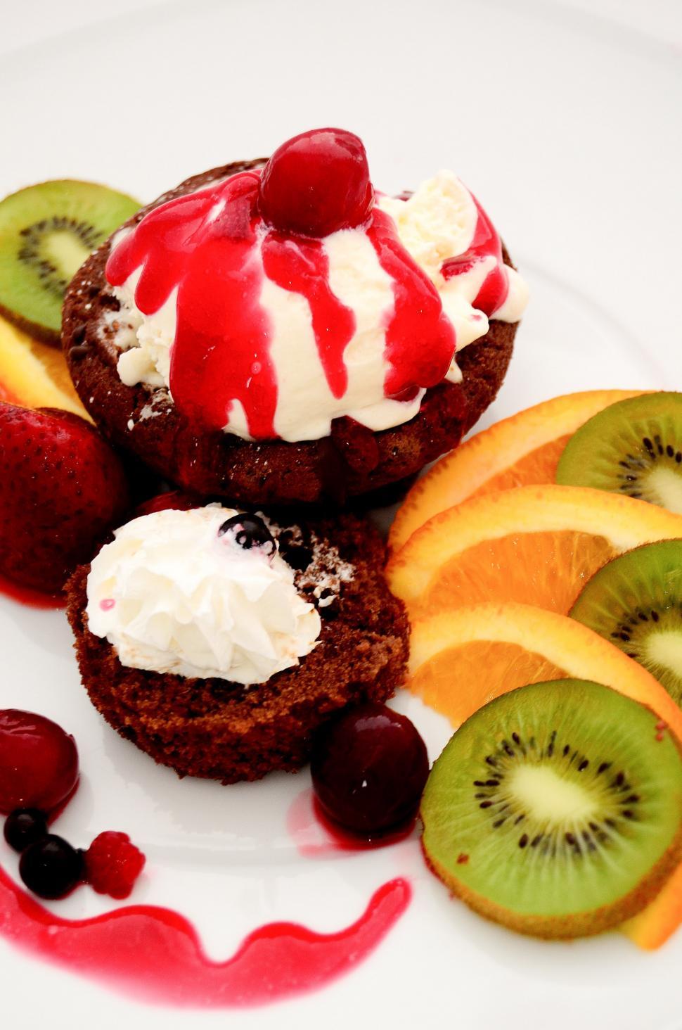 Free Image of White Plate Topped With Fruit and Ice Cream 