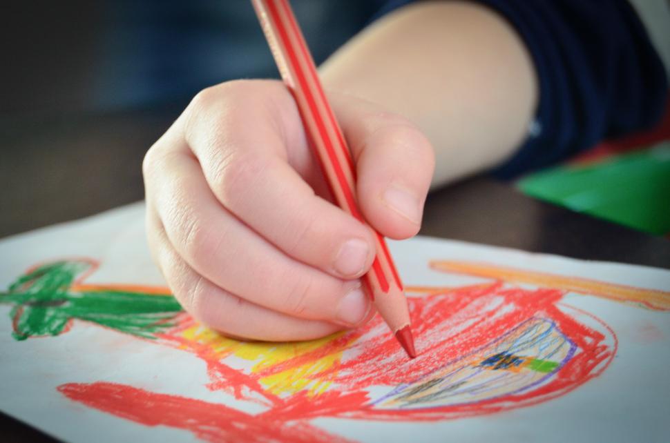 Free Image of Childs Hand Drawing With Pencil 