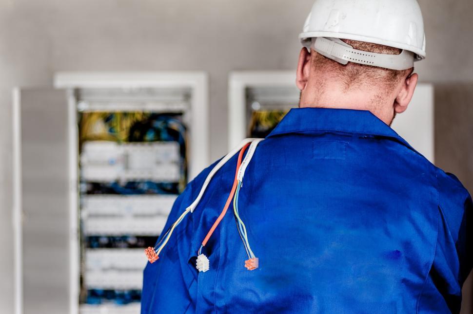 Free Image of Construction Worker in Hard Hat and Blue Jacket 