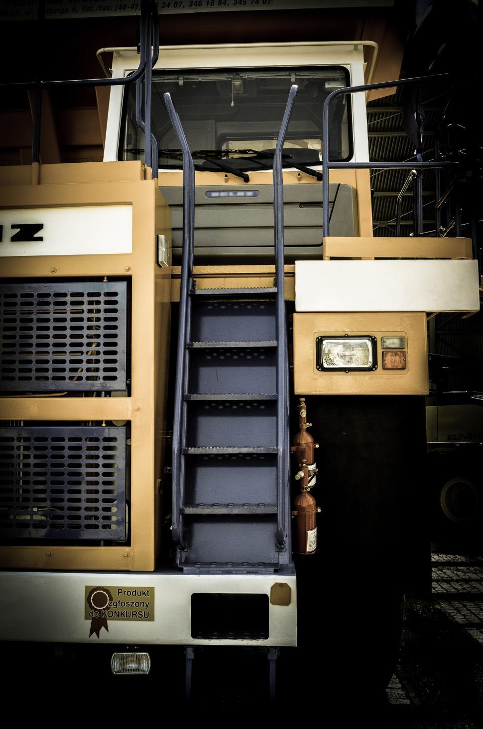 Free Image of Large Truck With Ladder Climbing Up Its Side 