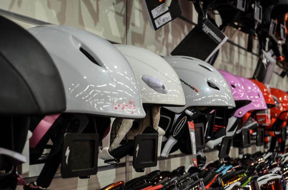 Free Image of Row of Helmets Hanging on Wall 