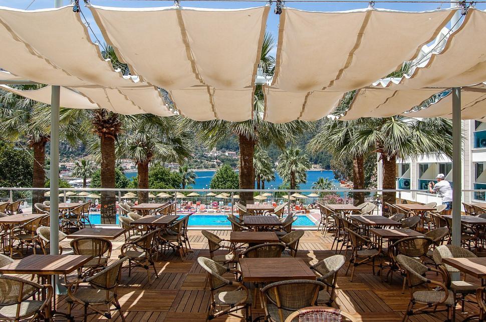 Free Image of Outdoor Dining Area With Tables and Chairs 