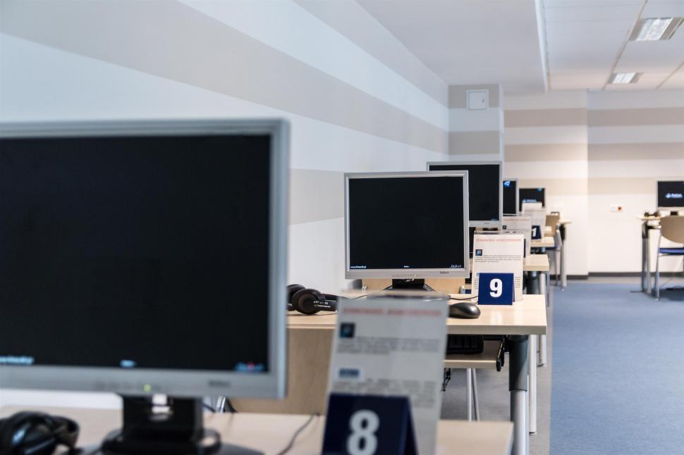 Free Image of Row of Computer Monitors on Desk 