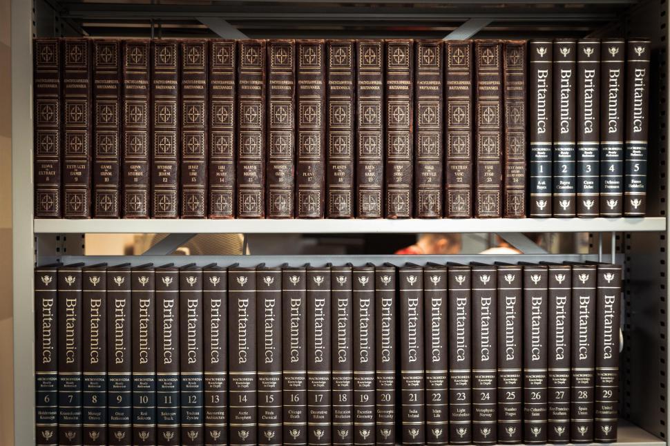 Free Image of Organized Bookshelf With Numerous Books 