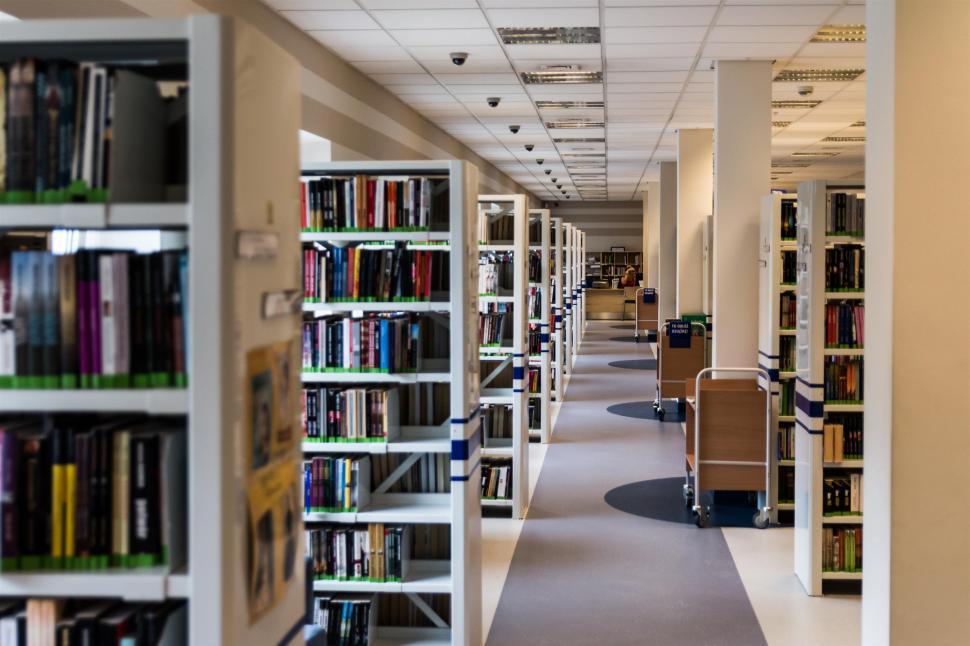 Free Image of Row of Bookshelves Filled With Books 