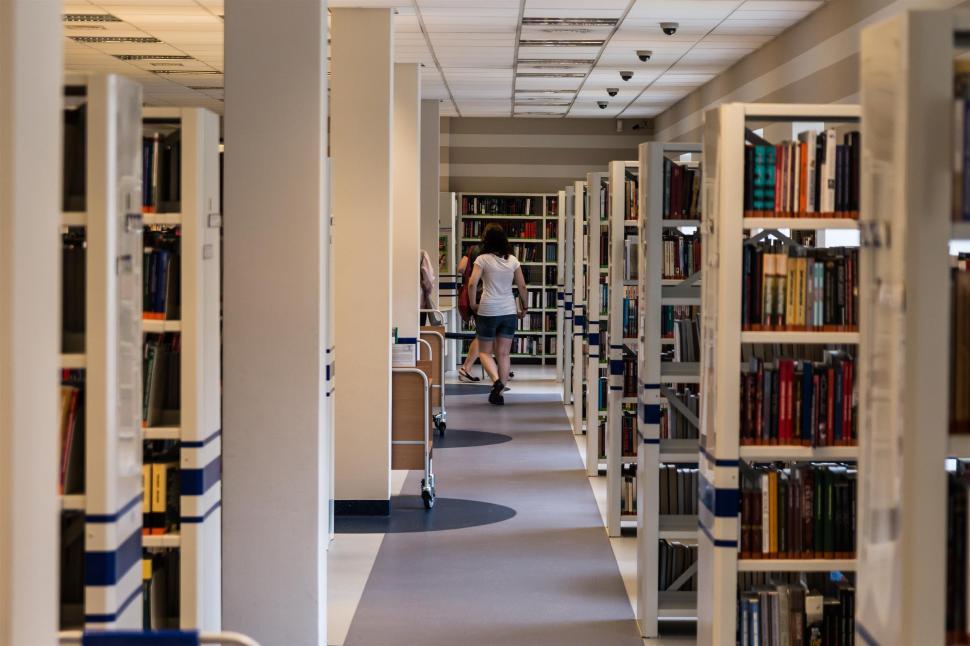 Free Image of Long Row of Bookshelves Filled With Books 