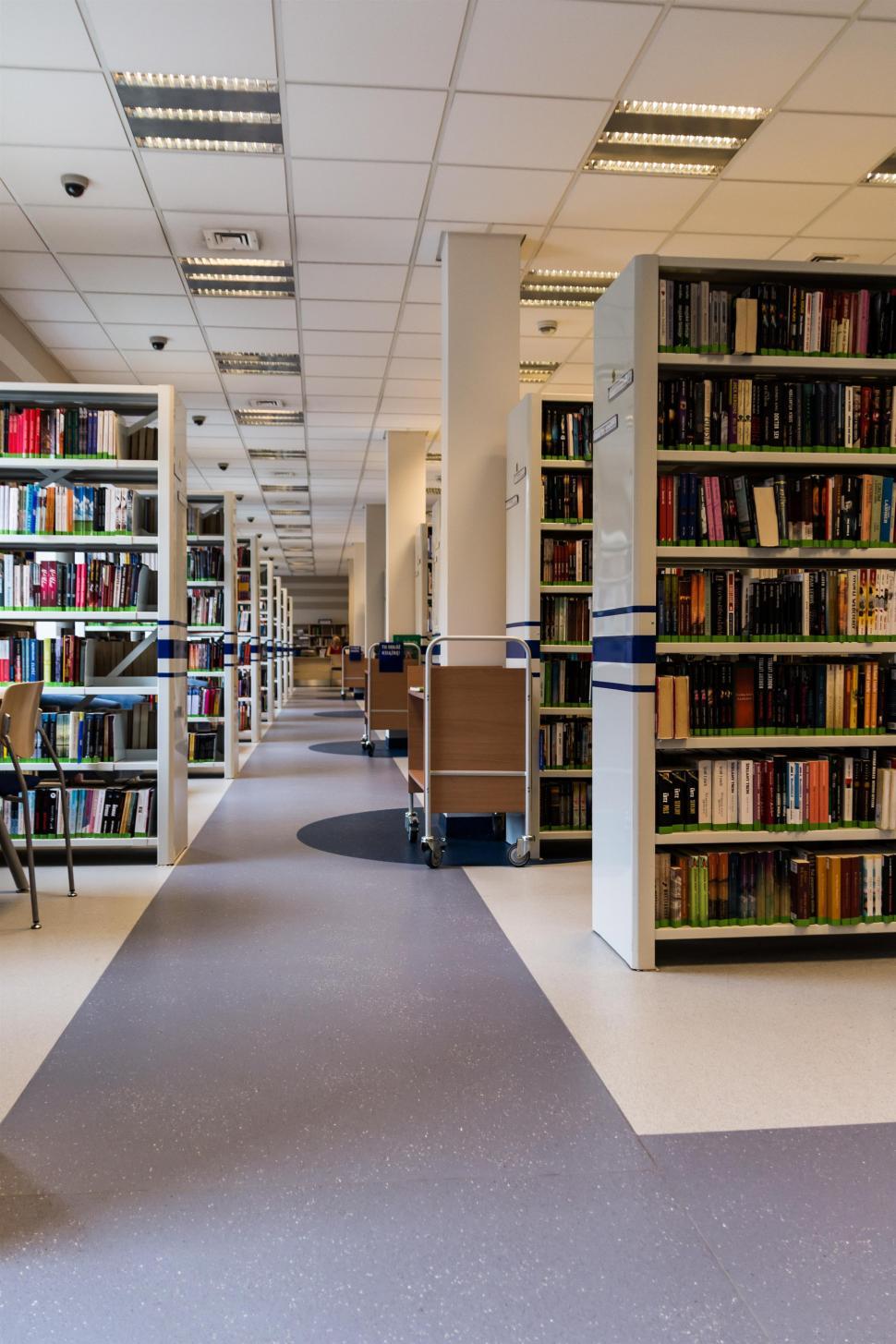 Free Image of Library Filled With Books and Chairs 