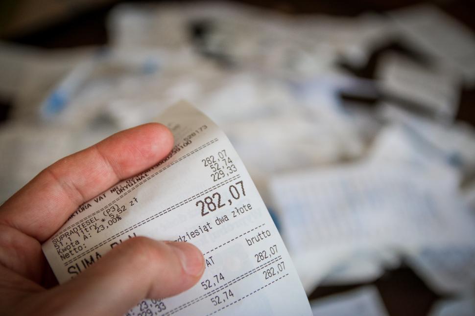 Free Image of Person Holding Receipt in Hand 