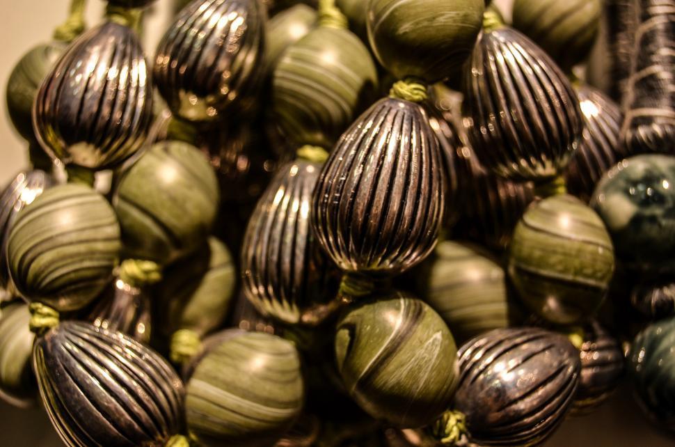 Free Image of Shiny Metal Ornaments Piled on Table 