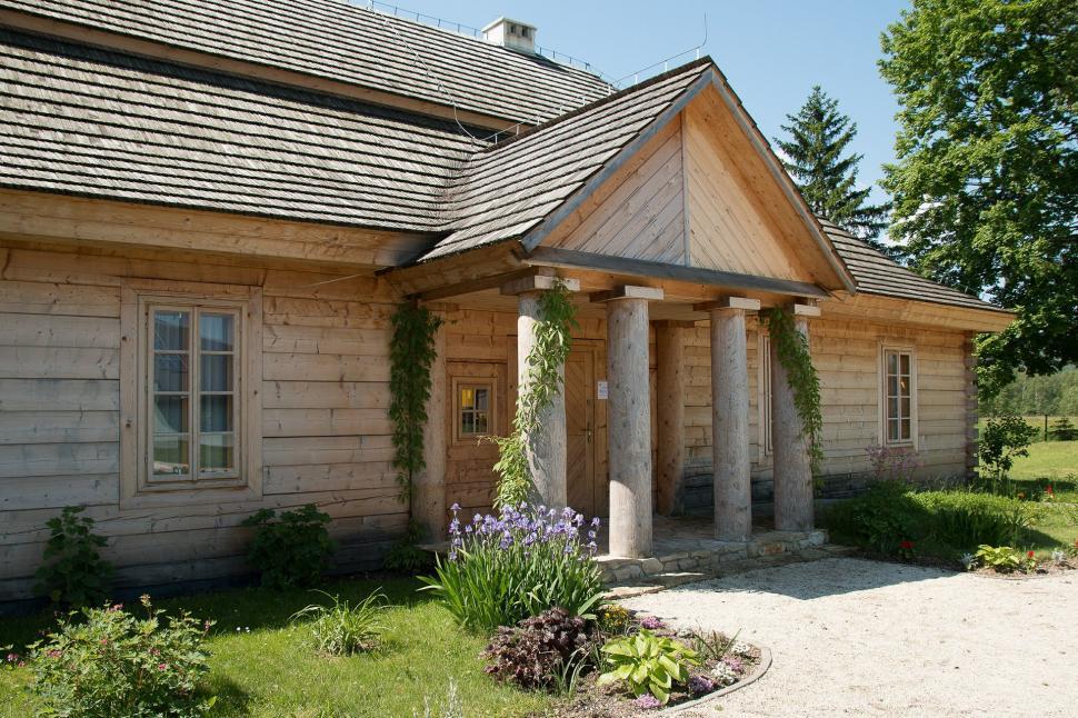Free Image of Small Wooden House With Porch and Columns 