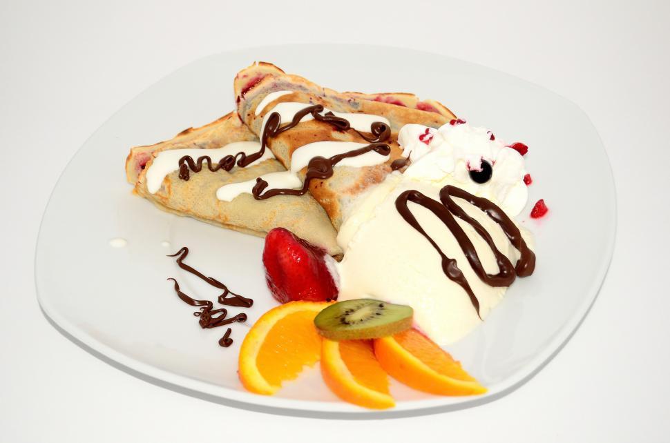Free Image of White Plate Topped With Fruit and Ice Cream 
