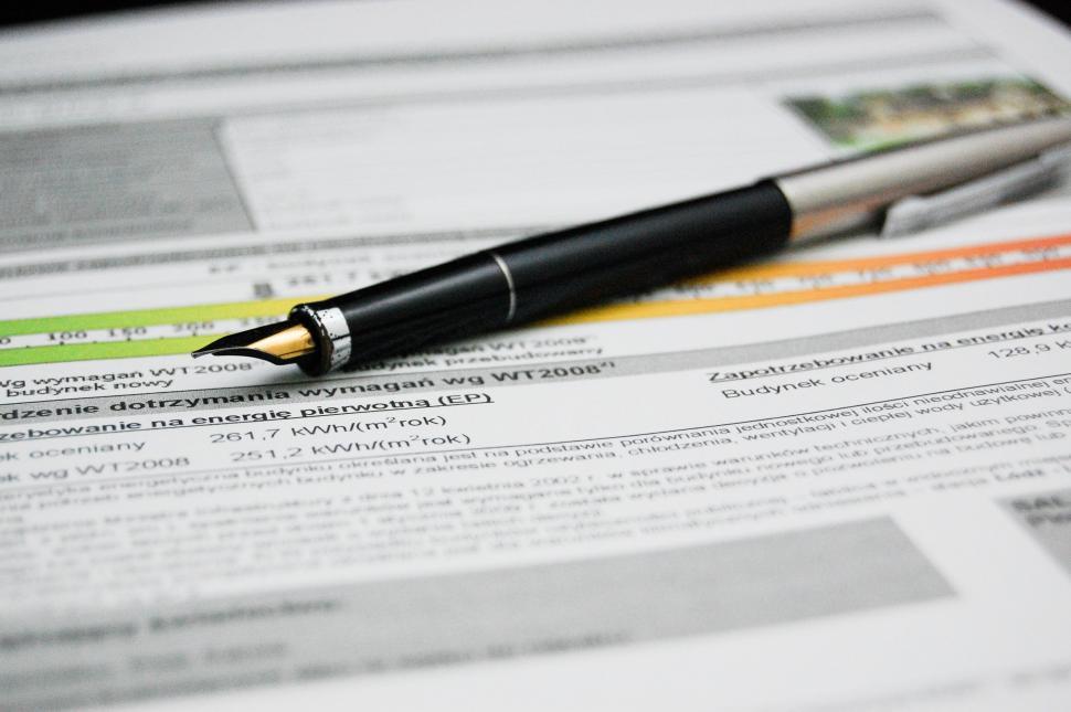 Free Image of Pen Resting on Paper 