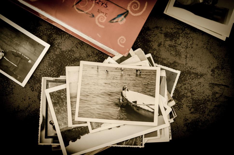 Free Image of Table With Pictures and Book 