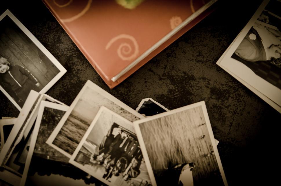 Free Image of Table With Pictures and Book 