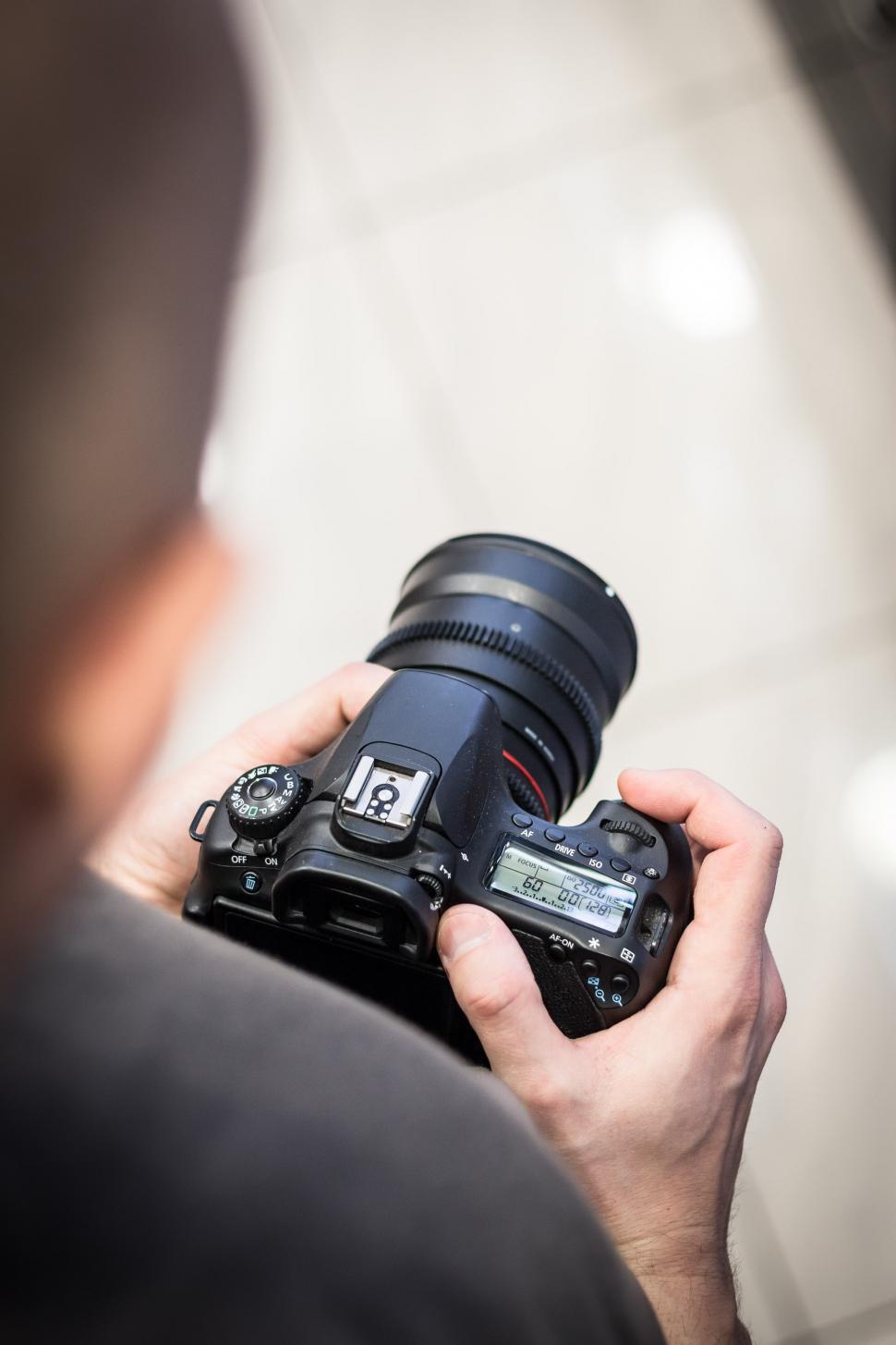 Free Image of Man Holding Camera 