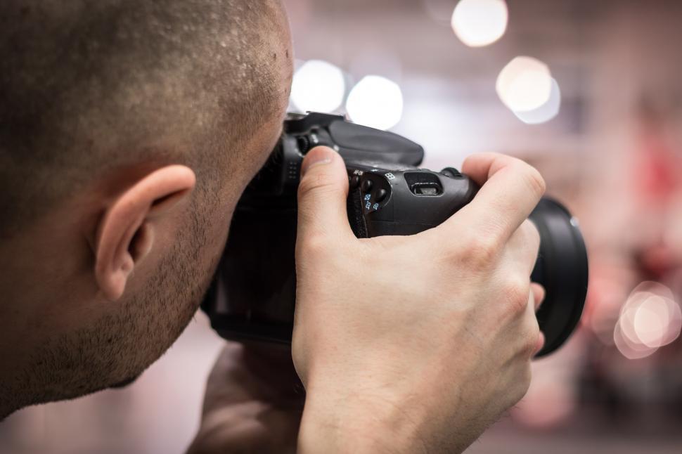 Free Image of Man Holding Camera Up to His Face 