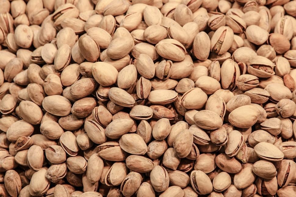 Free Image of A Pile of Nuts on a Table 
