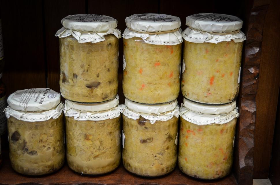 Free Image of Stack of Jars Filled With Food on Shelf. 