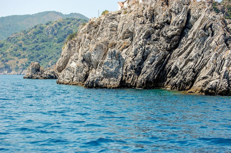 Free Image of Rock Outcropping in the Middle of a Body of Water 