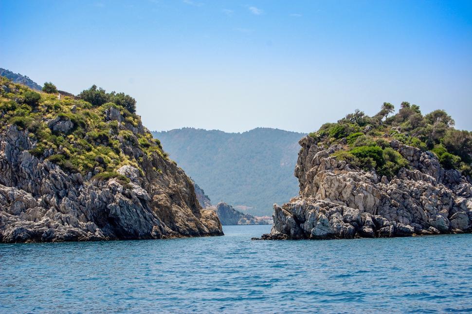 Free Image of Two Large Rocks in Middle of Body of Water 