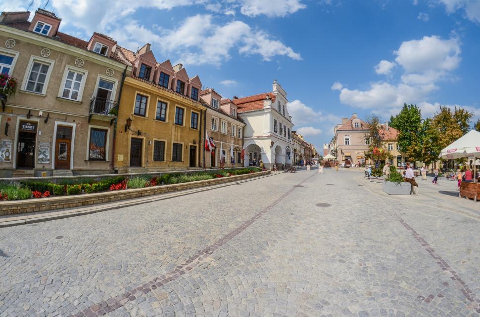 Free Image of Busy Street Scene With Buildings and People 