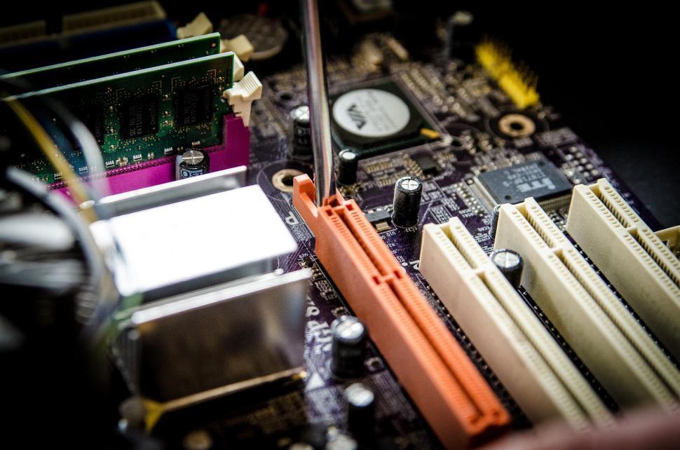 Free Image of Close Up of a Computer Motherboard With Wires 