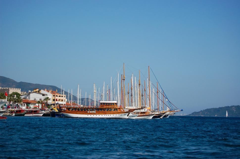 Free Image of Group of Boats Floating on Body of Water 