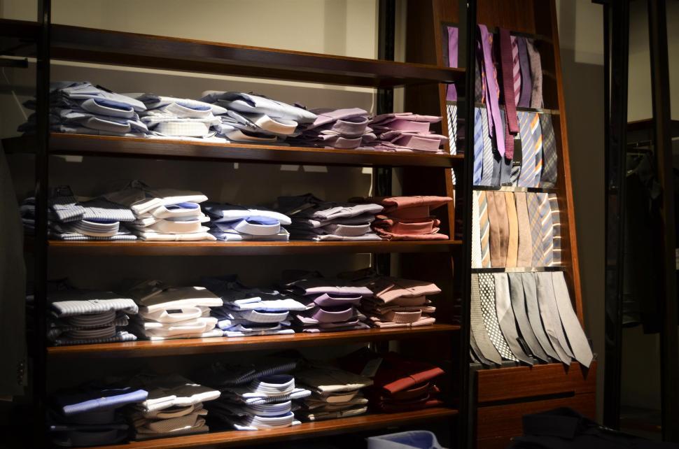 Free Image of Shelf Filled With Folded Shirts 