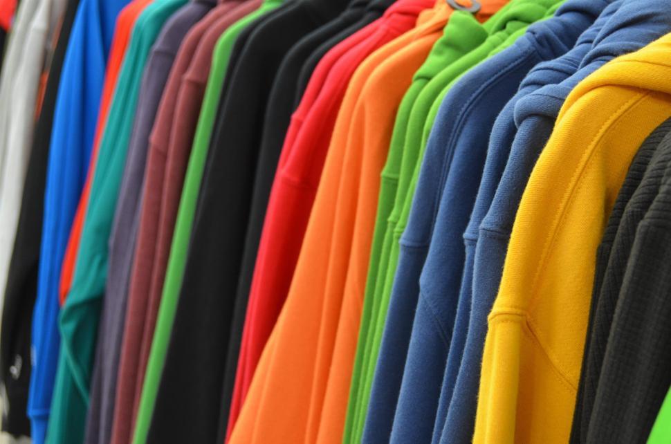 Free Image of Assorted Shirts Hanging on a Rack 