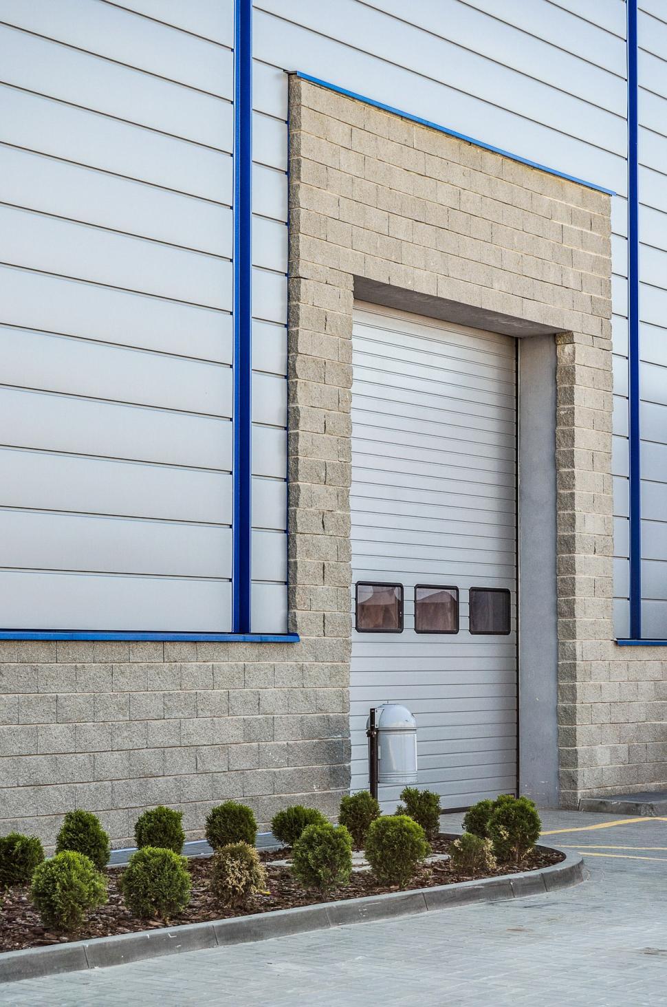 Free Image of White Fire Hydrant in Front of Building 