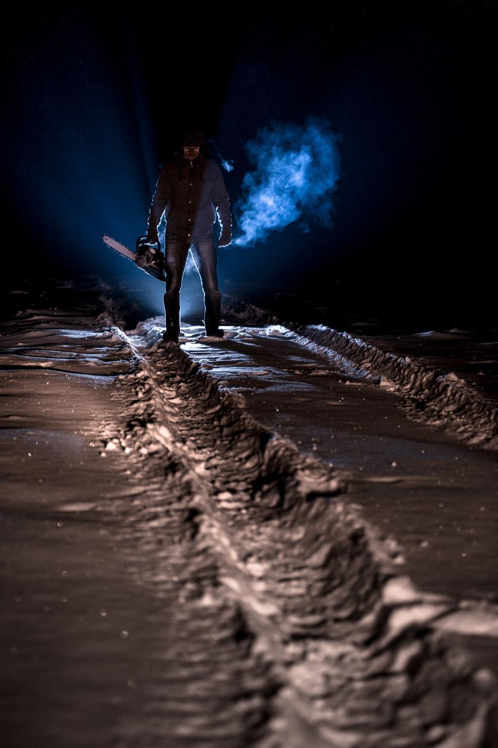 Free Image of Man Holding Snowboard in Snow 