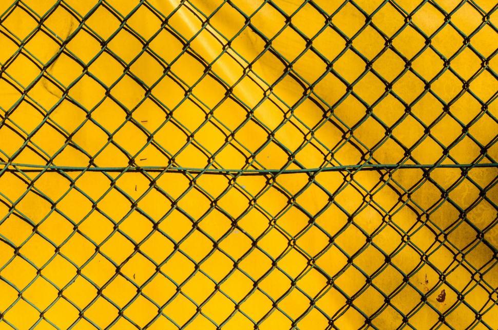 Free Image of Close-Up of Fence Against Yellow Background 