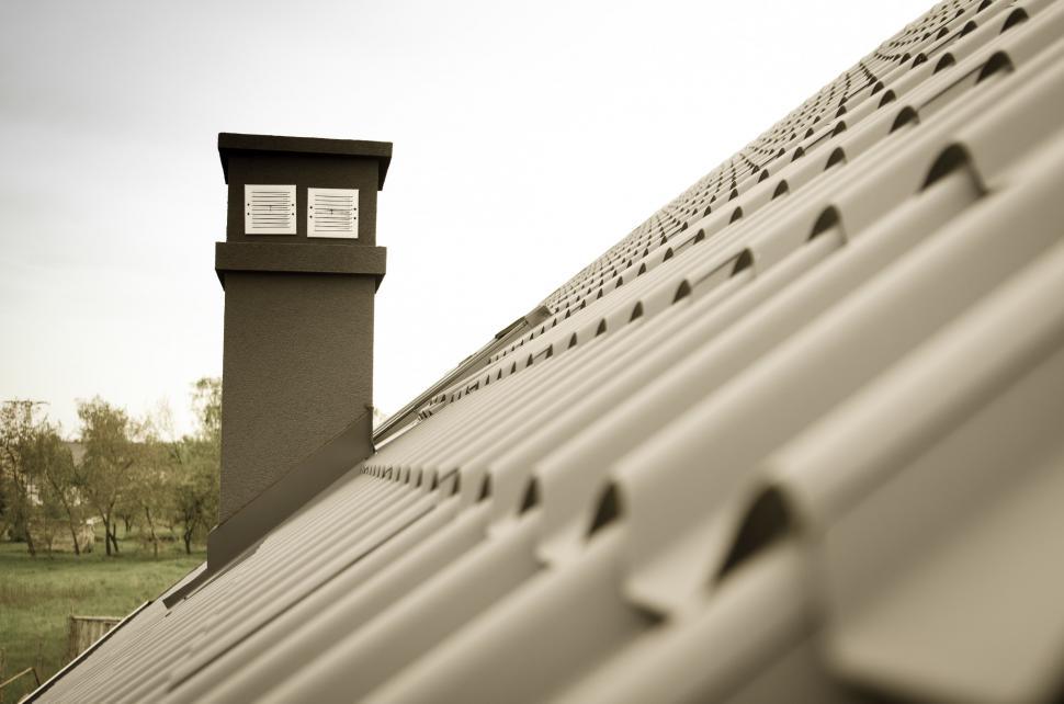 Free Image of Roof With Clock Tower in the Background 