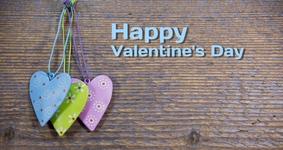 Free Image of Two Hearts Hanging From a String 
