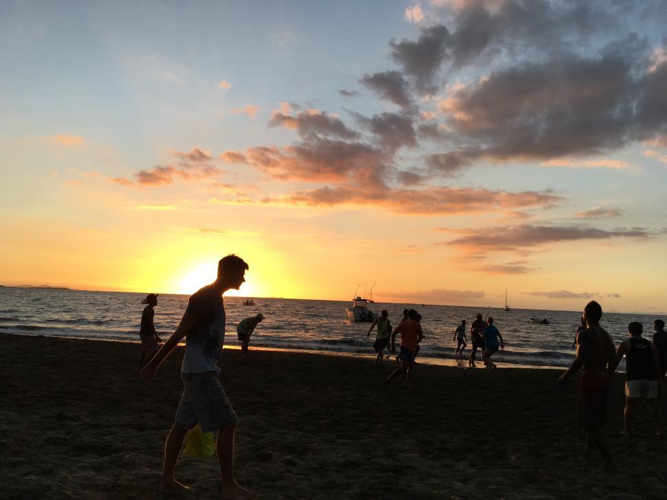 Free Image of Young people on a beach 