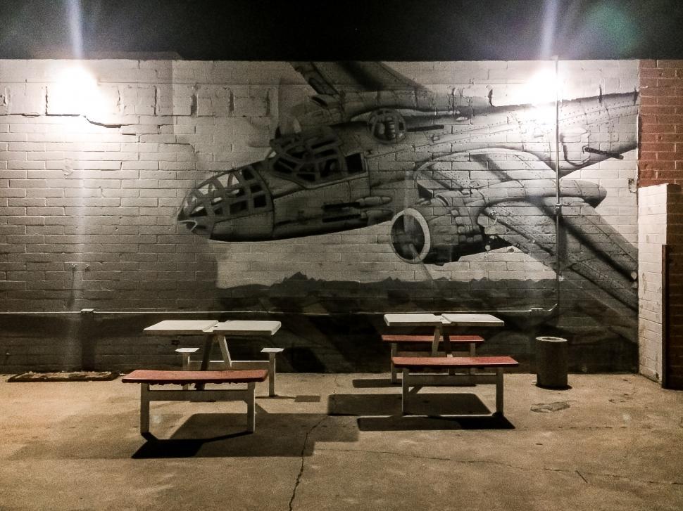 Free Image of Outdoor seating with mural 