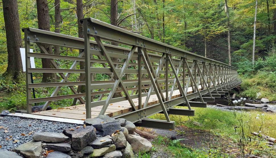Free Image of Metal Frame Foot Bridge Over a Creek 