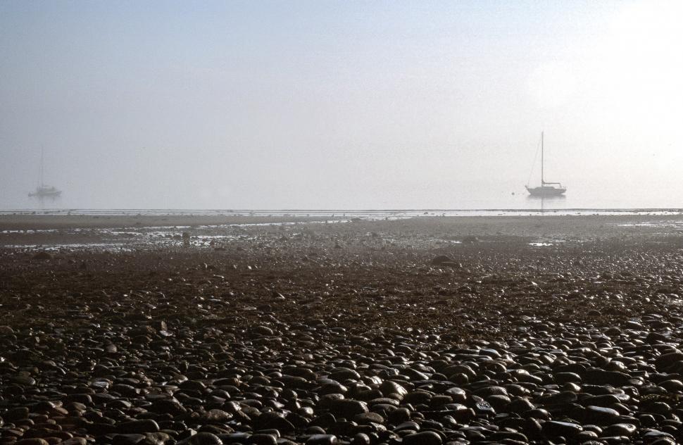 Free Image of Sunlight on pebble stones 