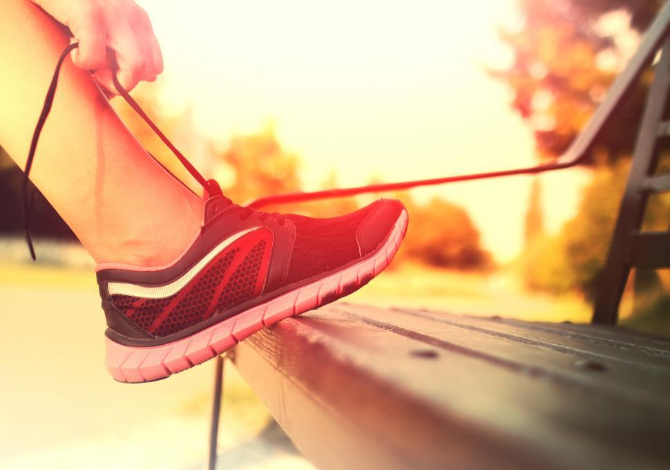 Free Image of Running Shoes - Woman Tying Shoe Laces 